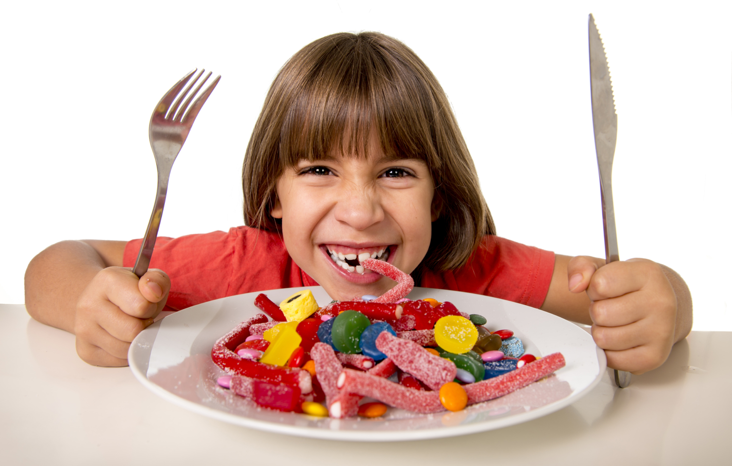child eating candy like crazy in sugar abuse and unhealthy sweet nutrition concept Sanident